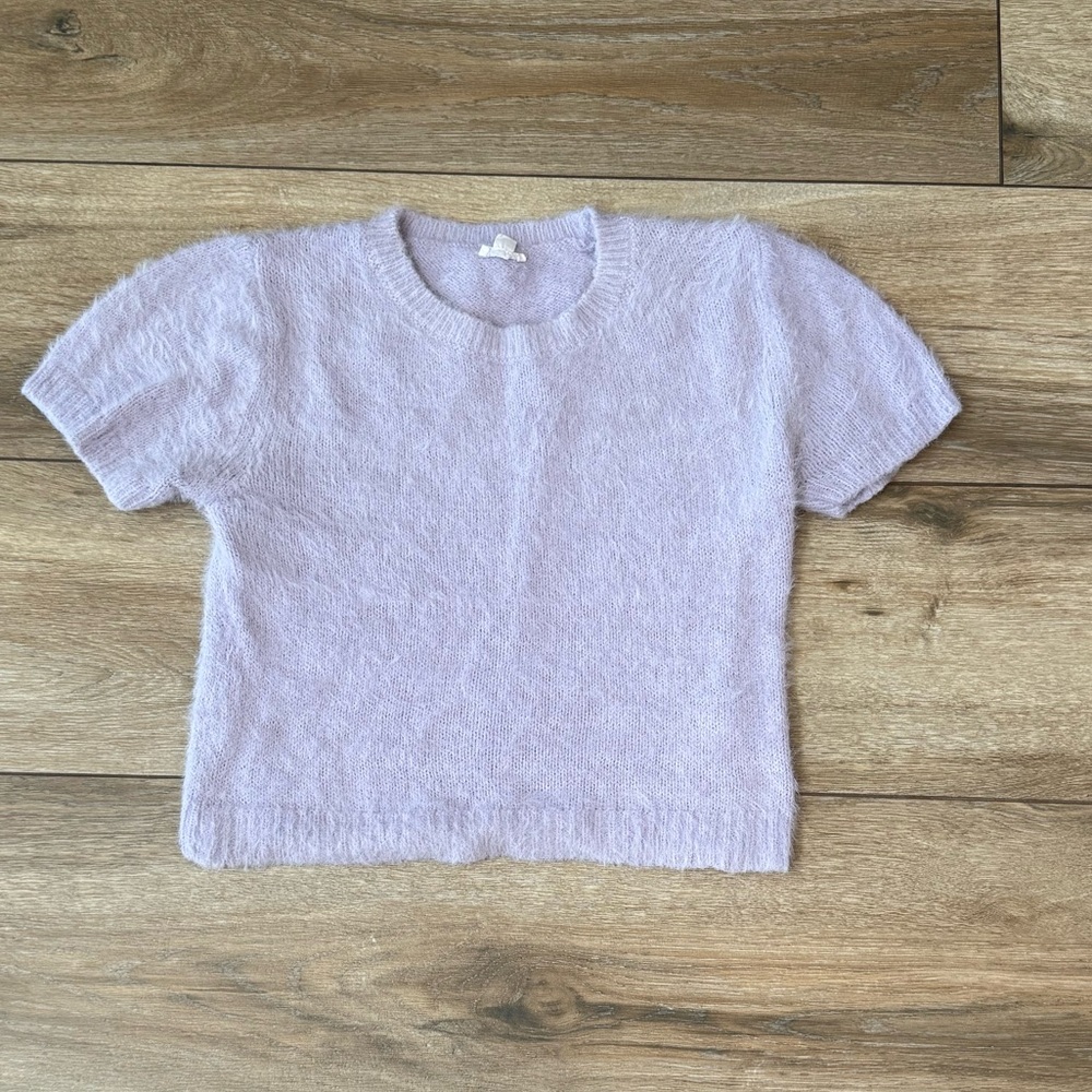 Cozy fuzzy short-sleeve sweater from Garage in a soft pastel lavender shade.